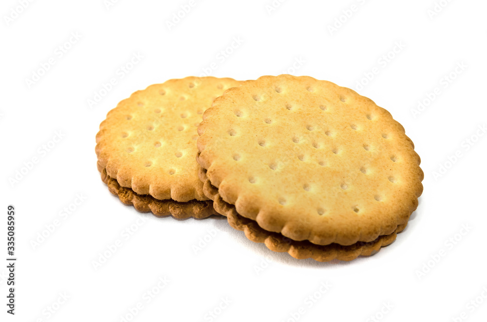 two sandwich cookies on a white background. Tasty cracker close-up. two sandwich cookies on a white background. Tasty cracker close-up.