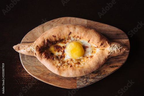 Khachapuri Adjarian top view. Popular Georgian dish photo