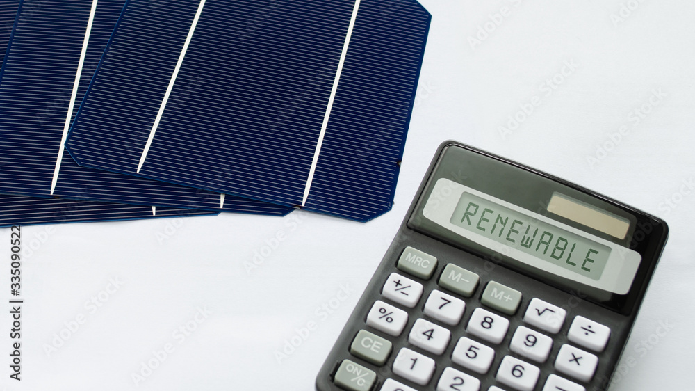 Solar energy cells with calculator showing the word Renewable in a  conceptual image for sustainable energy sources foto de Stock | Adobe Stock