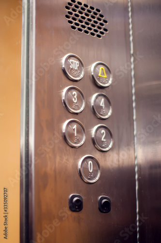 Silver panel with buttons in the elevator