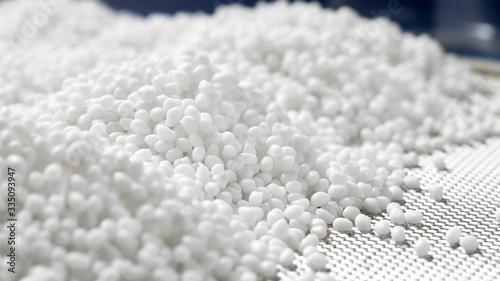 Photography Closeup of a white plastic polymer granule