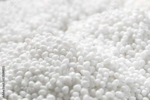 Tableau sur toile Closeup of a lot of granules of white plastic polymer
