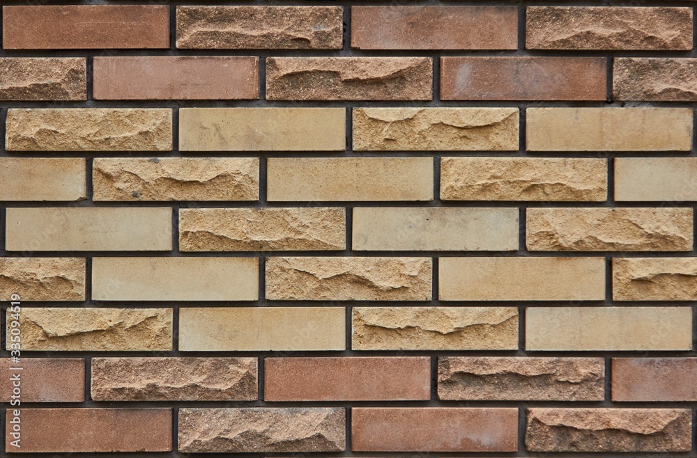 Brick wall of multi-colored bricks Brick wall of multi-colored bricks