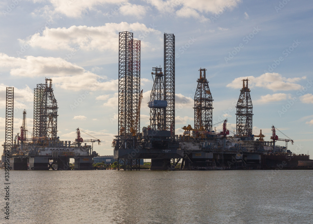 Oil drilling platforms moored at the Port of Galveston for repairs