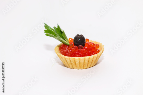 red caviar in tartlets close up on a white background