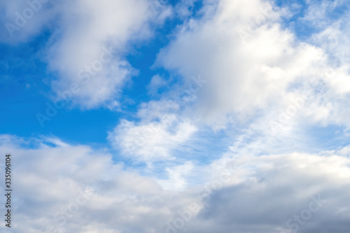 Cumulus and Cirrocumulus clouds on blue sky, nature background.