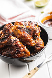 Grilled chicken wings in bowl.