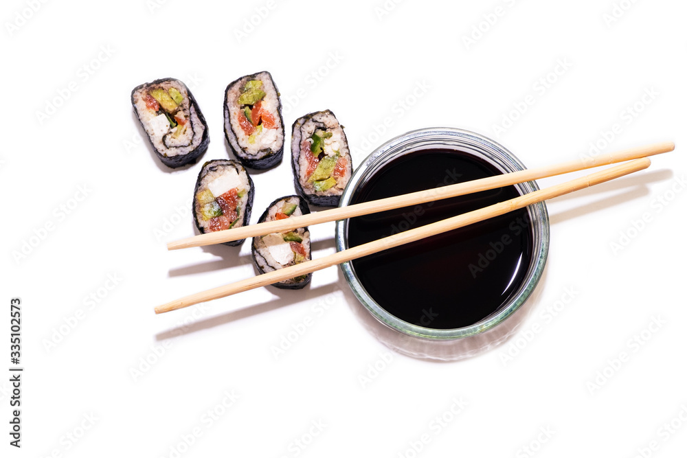 Keto diet. Rolls of cabbage, cucumber and red fish. Chopsticks and Soy Sauce Keto diet. Rolls of cabbage, cucumber and red fish. Chopsticks and Soy Sauce