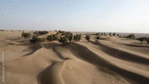 A stunning snap shot of the drone in the Hema Desert, trees, drylands and red dunes, Sultanate of Oman photo