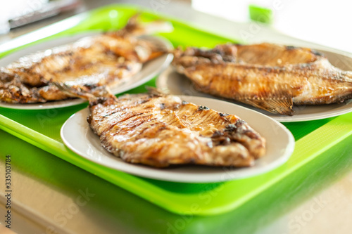 Three White Dishes of Pacu Fish (Serrasalmus) in Yapacani, Santa Cruz / Bolivia photo