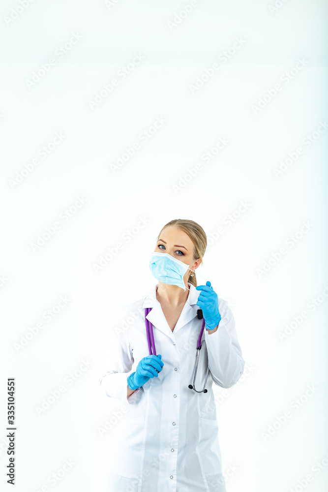 doctor nurse puts on a protective mask. A nurse in a respiratory mask. Put on masks. Wear gloves. beautiful blonde doctor shows how to put on a protective respiratory mask isolated on a white backgrou
