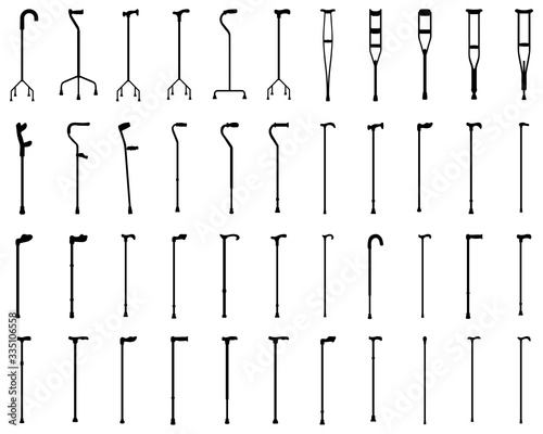 Foto Black silhouettes of walking sticks and crutches on a white background