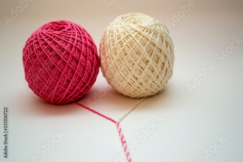 Ball of thread in two colors. Red and white
