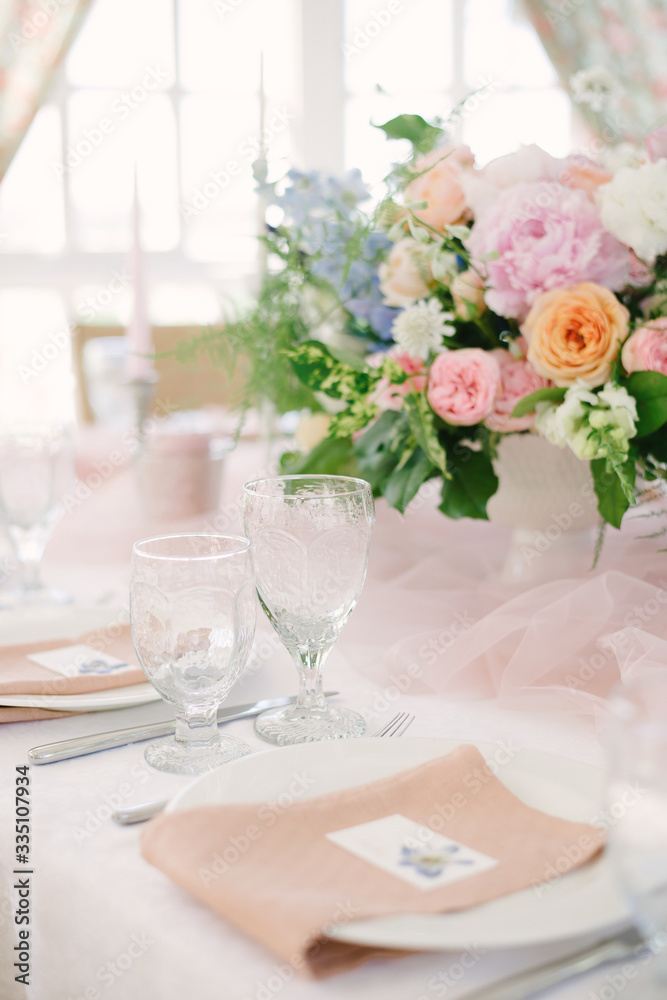 Table setting at a luxury wedding and Beautiful flowers on the table.