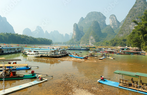 Tourist Boats Docking on the Li River  Yangshuo  which is known for its dramatic karst mountain landscape and for outdoor recreation.