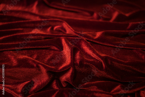 Velvet fabric with pleats as background.