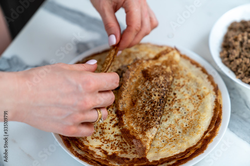cooking delicious pancakes with meat filling