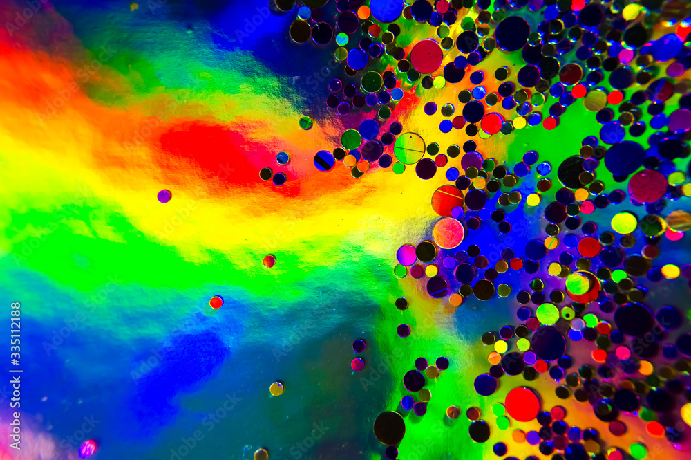 Holographic, goniochromism macro rainbow texture. Ligh leaks, disco illumination effect. Abstract background. Iridescent phenomenon. Small colorful glitter confetti.