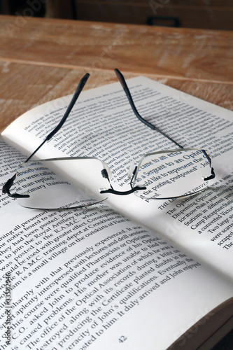Glasses and open book
