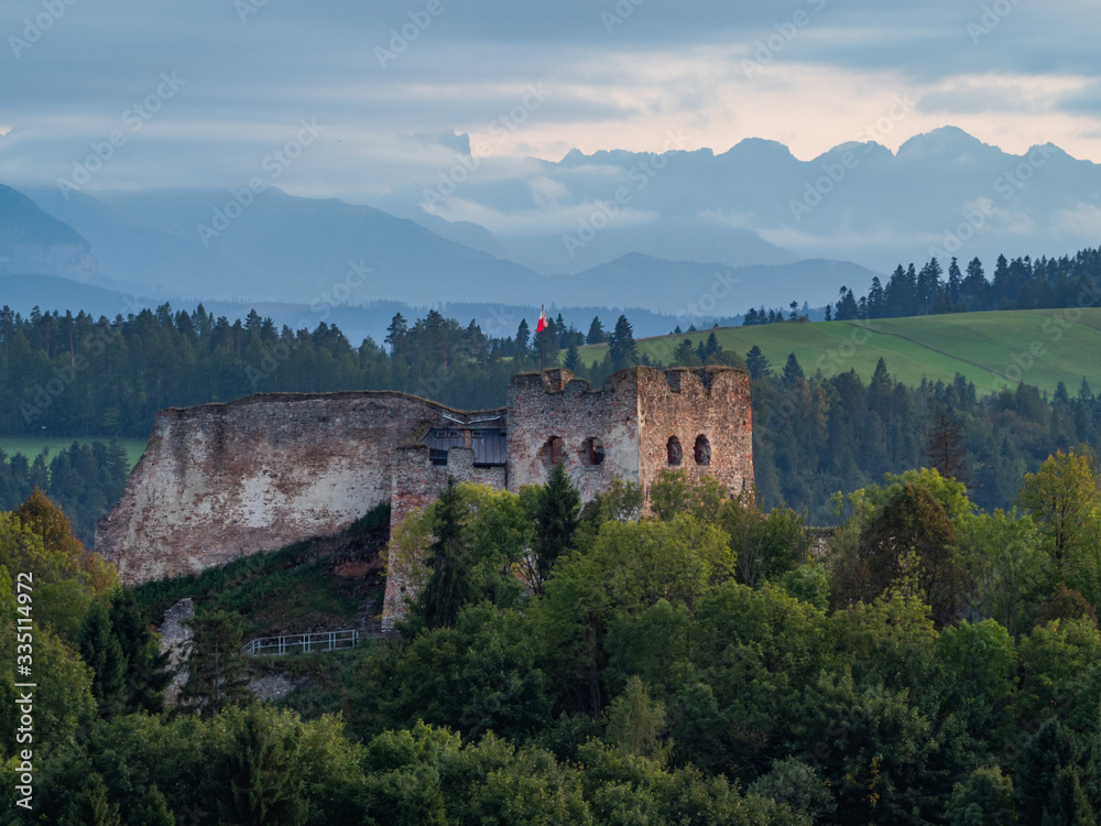 Castle in Czorsztyn against the background of silhouettes Tatra mountains, Poland