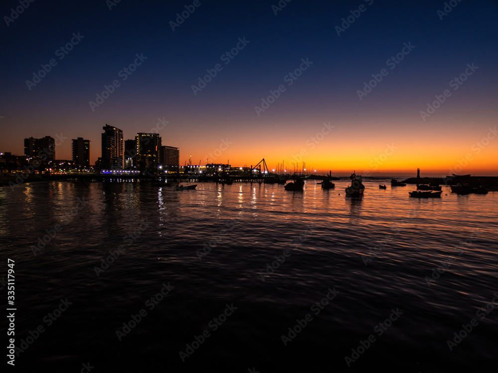 Beautiful sunset in front of the port of Antofagasta Chile.