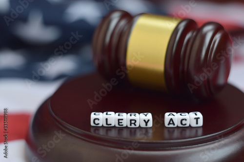 Justice mallet and Clery act characters with US flag on background photo