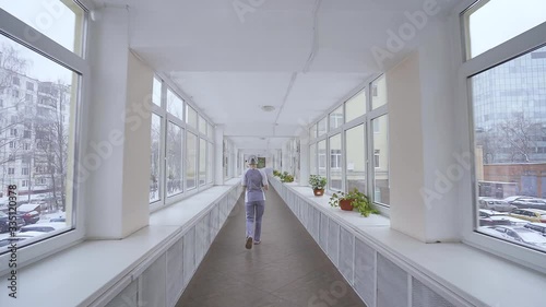 Lonely doctor walks down corridor in Russian hospital where there are not enough doctors