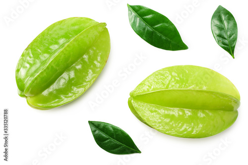 Carambola with green leaves isolated on white background. top view
