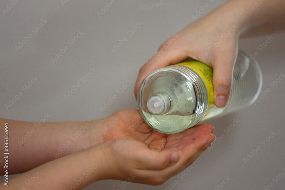 The person is pouring Turkish cologne (Turkish Kologne) to palm of a