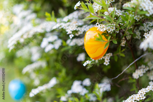 Orange plastic easter egg decoration spirea shrub easter