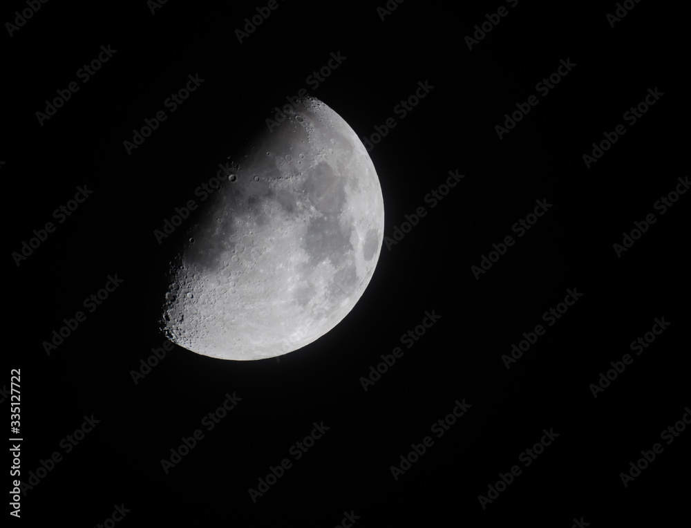 Half moon with black sky background at night Half moon with black sky background at night