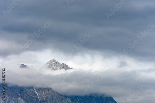 Snowy peak of the Dolomites that like Mount Olympus, in Greek mythology, stands out among the clouds