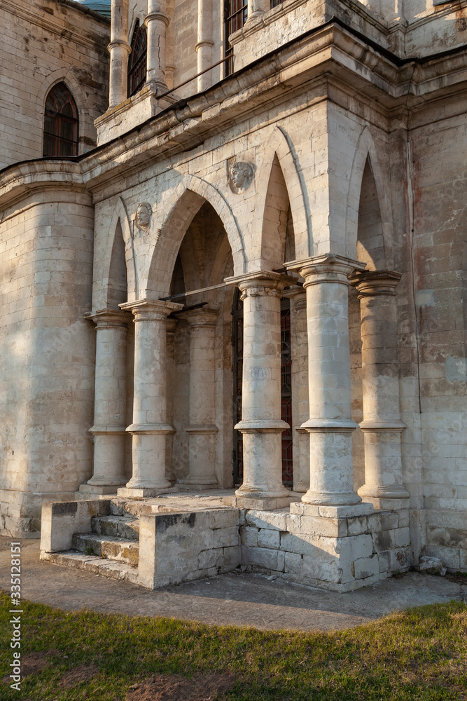 Fragment of the facade of an old Orthodox church in the form of a balcony with columns