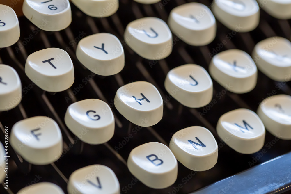 Close up of letters on an old fashioned typewriter keyboard Close up of letters on an old fashioned typewriter keyboard