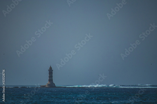 Light house at the westernmost part of mainland africa, on the peninsula of Almadies close to Yoff in Dakar, on a hazy hot day. © Anze