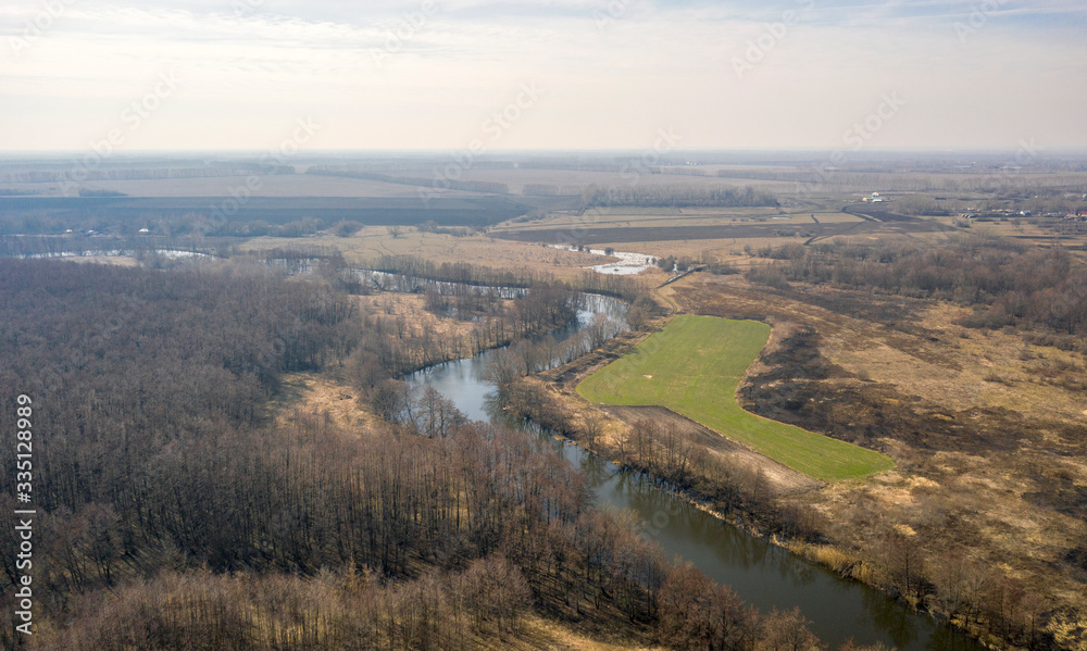 Aerial photo of a winding river in early spring