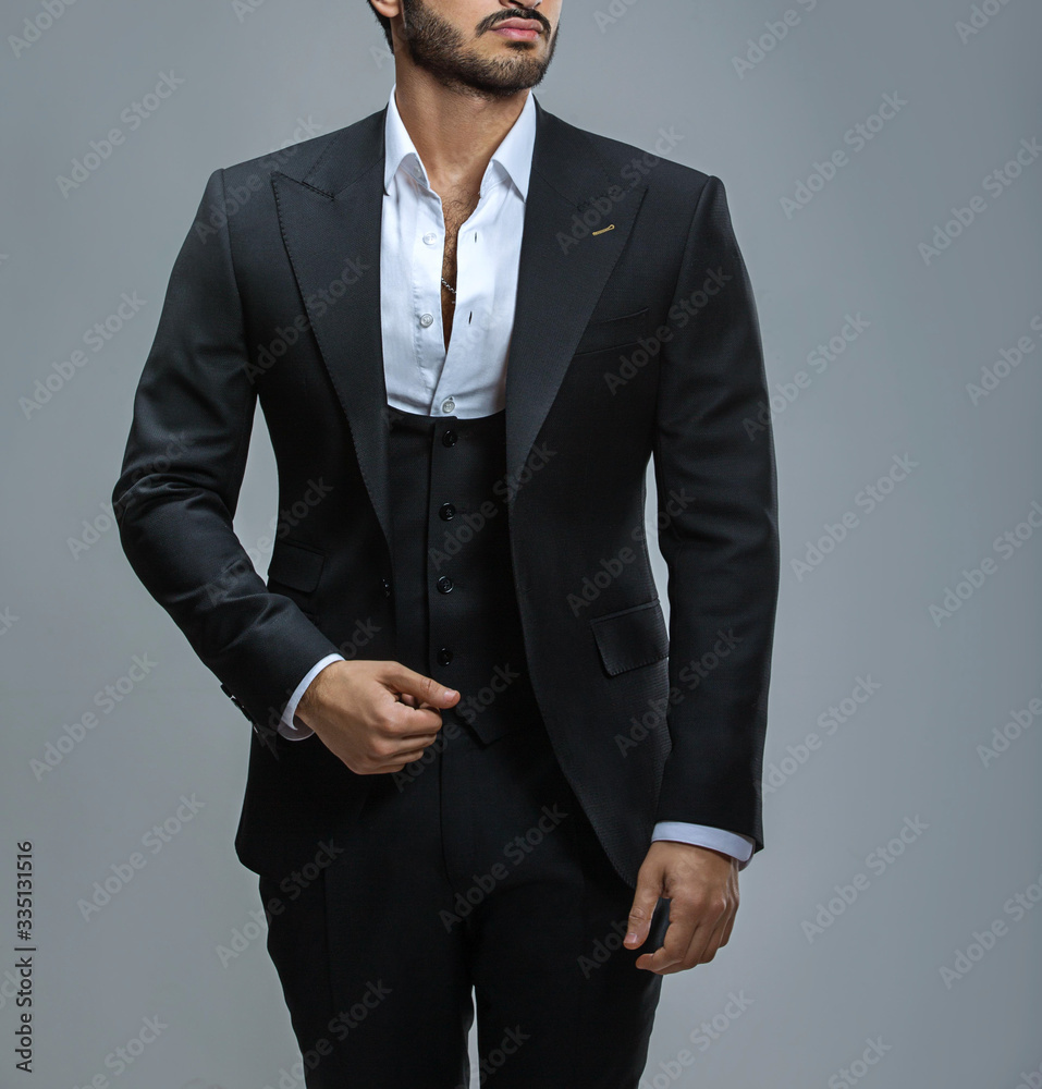 Atelier to repair clothes, Stylish look, Fashion look, Men look, Wedding style, Fashion concept, Brand clothing, Classic costume,Suit on black background. Store display. Classic style. Grey background Atelier to repair clothes, Stylish look, Fashion look, Men look, Wedding style, Fashion concept, Brand clothing, Classic costume,Suit on black background. Store display. Classic style. Grey background