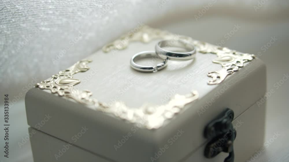 Wedding rings are on the box. Beautiful decorations for engagement party