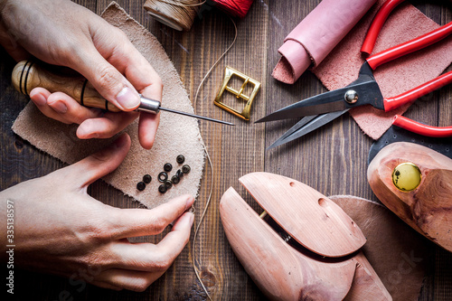 cobbler tools in workshop dark background top view photo