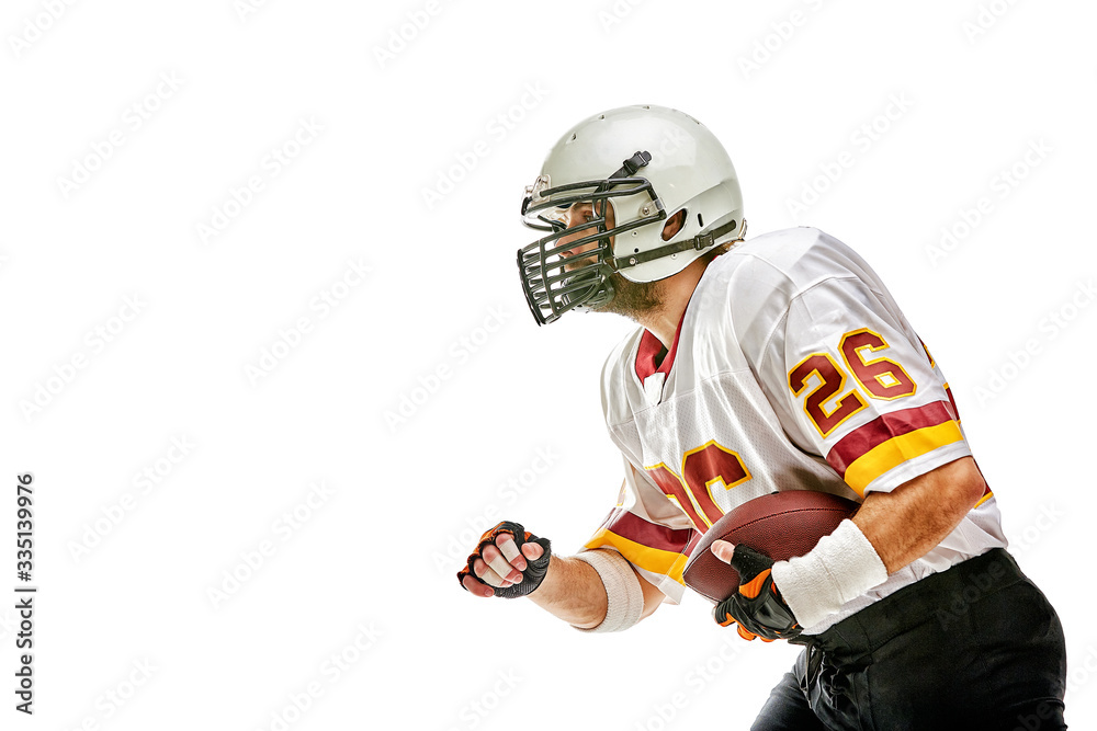 American football player posing with ball on black background. Super Bowl concept. Concept American football, portrait American, Motivator. Black white background, copy space. Isolate