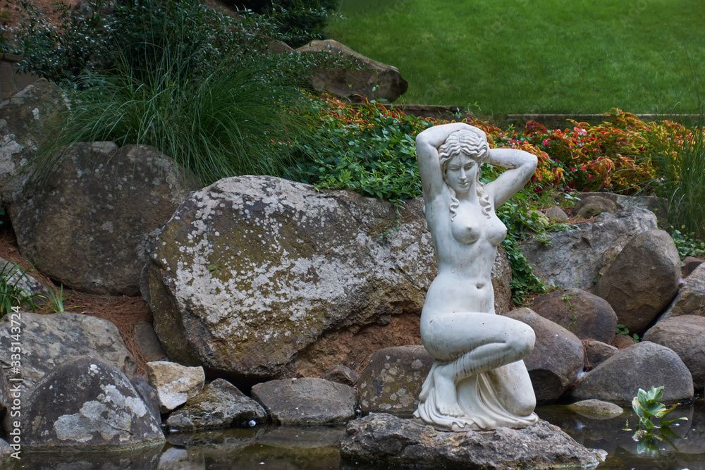 White marble statue from Greek mythology. Beautiful woman in Aivazovsky landscape park (Park Paradise) in Partenit. ALUSHTA - AUGUST 4, 2016