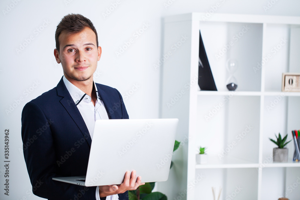 Solid businessman in a jacket works in office of company. Solid businessman in a jacket works in office of company.