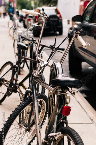 Bicycle parked on the street with a safety lock. Manhattan