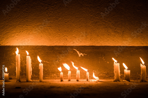 Burning candles in the dark photo