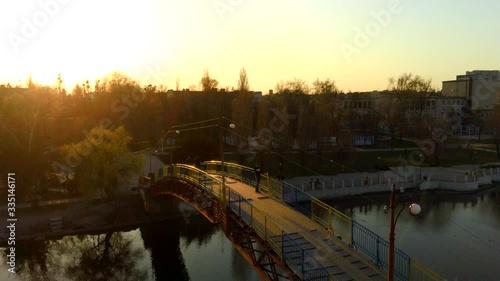 man on the bridge drone sunset video, 4k video