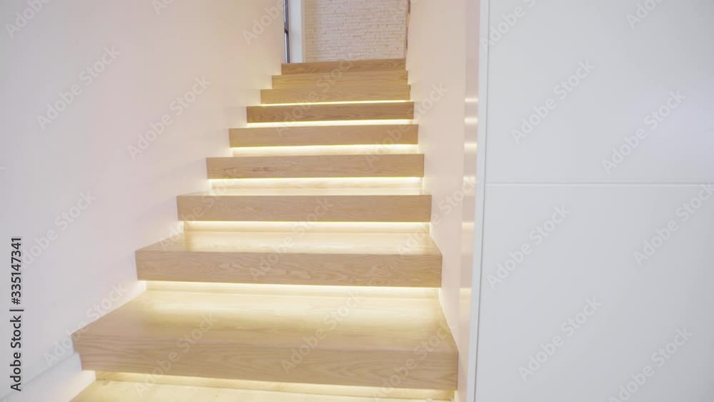 Climbing Wooden stairs. Someone step by step climbs the steps POV. Climb up the stairs, Modern interior, Villa interior steps