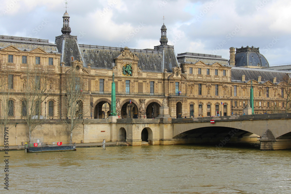 Panorama of the old part of Paris overlooking the River Seine bridge and ancient buildings in the distance.