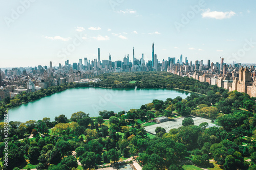 Spectacular Wide View over Central Park in Manhattan with beautiful Rich Green Trees and Skyline of New York City 