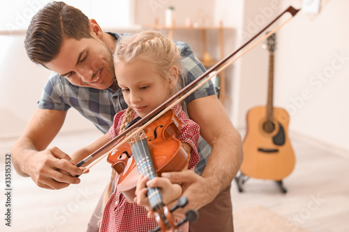 Teacher giving music lesson...