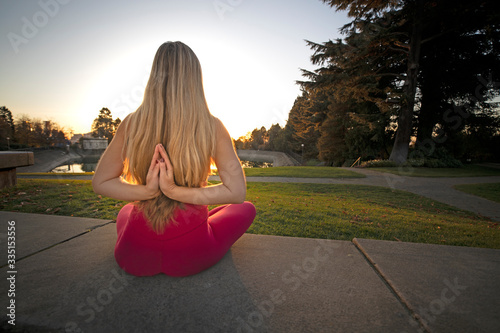 Yoga Meditation Woman in Zenlike Mindstate Seated Pose photo